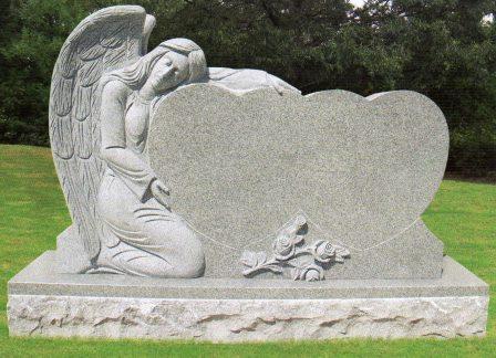 Elegant headstone with an angel embracing a heart