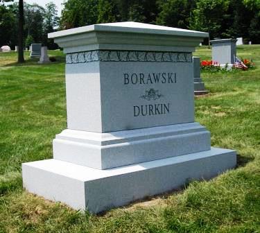 A mult-i level headstone with a sturdy base
