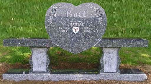 A memorial heart in the center of a bench
