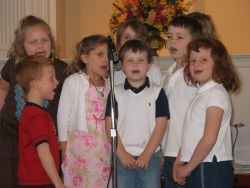 Children singing at a church event