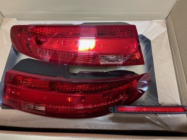 On offer is a full set of Aston Martin Vantage V8/V12 Rear Lights in Red.   The set comprises of the left and right cluster and the boot lid brake light.   Fixings/ Seals may be required if you don’t have them.  They are in excellent clean working order with no scratches or damage to the lenses and have never had any condensation problems.   Ready for shipping unless collection is preferred.   £1150.00