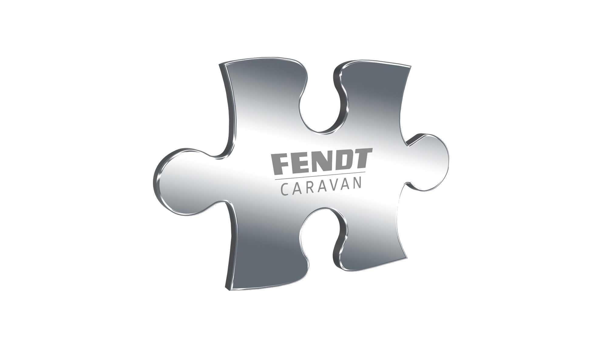 Metall-Puzzleteil mit dem Fendt-Caravan-Logo